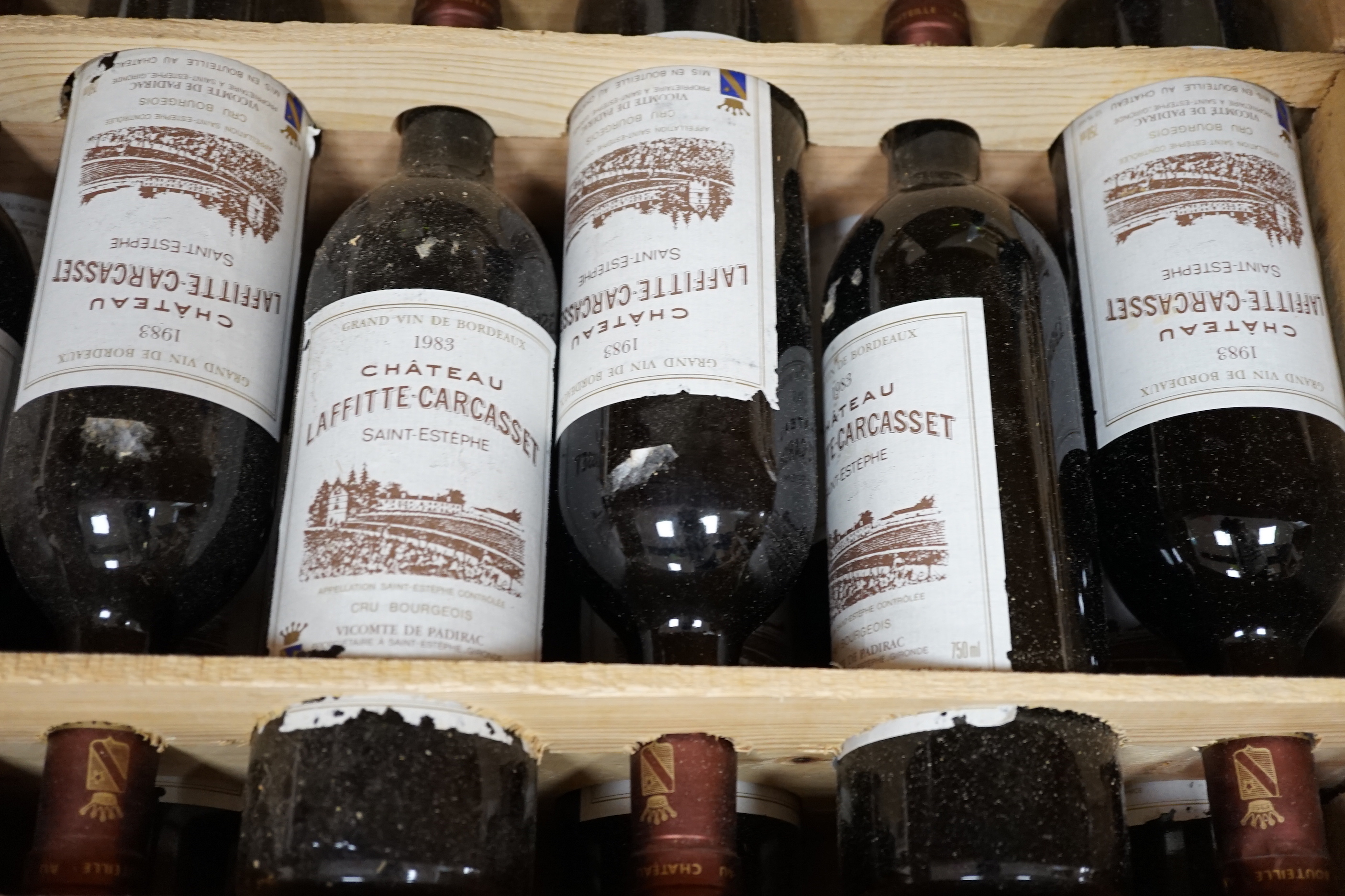 Twelve bottles of Chateau Laffitee Carcasset, 1983, in OWC
